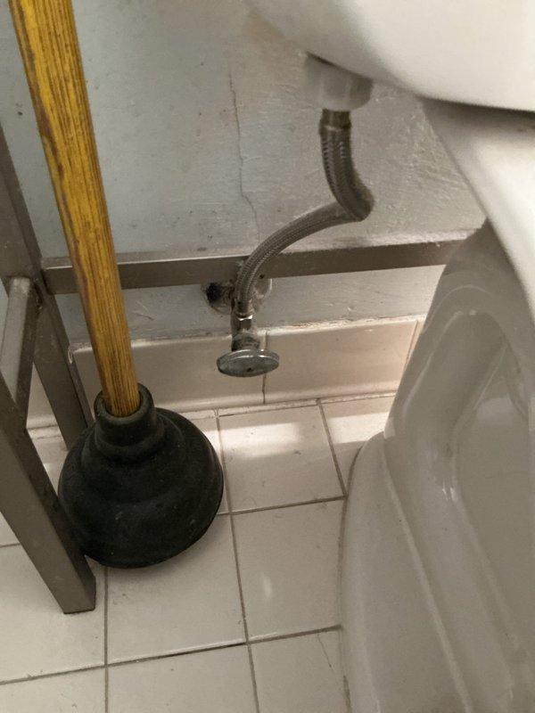 Responded to first-floor toilet not flushing properly with water failing to drain from bowl. Upon inspection, found original flush mechanism from 2014 showing significant wear and mineral buildup consistent with heavy daily use. Removed tank lid and assessed flush valve and fill valve assemblies, both exhibiting deterioration of internal components. Replaced complete flush valve assembly including flapper and overflow tube, and installed new fill valve with adjustable float mechanism. Tested flush cycle multiple times to verify proper water flow, bowl evacuation, and tank refill operation. Adjusted water level to manufacturer specifications and confirmed shut-off valve and supply line connections were secure with no leaks. Toilet now flushing completely and refilling properly.