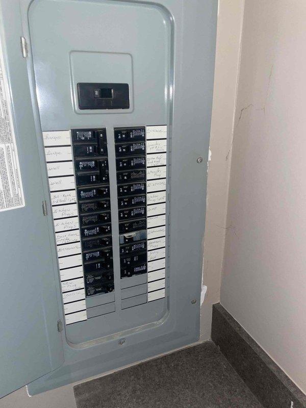 Conducted on-site evaluation for air conditioning system replacement. Existing 10-year-old AC unit located at rear of property assessed for replacement options. Documented electrical panel configuration and existing ductwork infrastructure to determine compatibility requirements for new equipment installation.