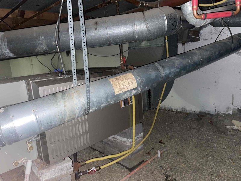 Conducted on-site evaluation for air conditioning system replacement. Existing 10-year-old AC unit located at rear of property assessed for replacement options. Documented electrical panel configuration and existing ductwork infrastructure to determine compatibility requirements for new equipment installation.