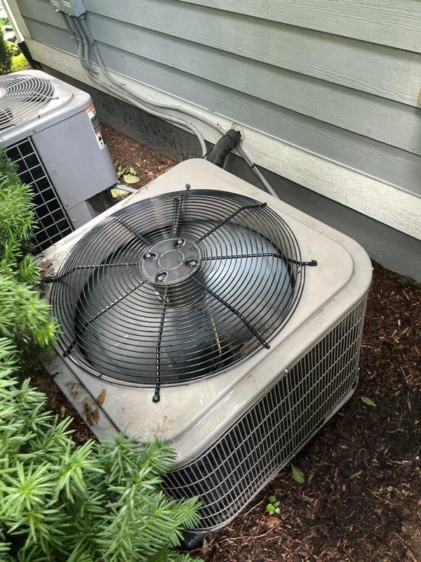 Completed comprehensive Gold AC Inspection on 5-year-old residential air conditioning system with air handler located in basement. Performed thorough evaluation of outdoor condenser unit, inspecting fan motor operation, refrigerant line connections, electrical components, and overall system performance. Verified proper system operation, checked refrigerant levels, cleaned condenser coils, and confirmed adequate airflow through unit. System found to be operating within normal parameters with no immediate service needs identified.