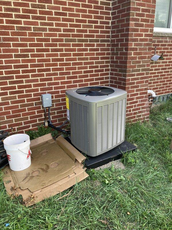 Completed full HVAC system replacement including installation of 70,000 BTU furnace in basement utility room and 2-ton air conditioning condenser unit in rear yard. Installed new ductwork connections with proper sealing, PVC condensate drain system, and humidifier integration. Reconnected all electrical components with exterior conduit to outdoor unit positioned on equipment pad against building foundation. Obtained mechanical and electrical permits prior to installation. System tested and operational, with utility rebate documentation completed.