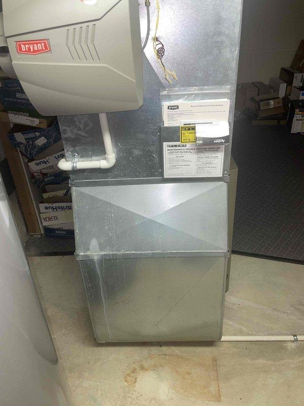 Responded to service call for air conditioning system failing to maintain setpoint temperature following extended power outage. System operational but unable to cool residence to thermostat setting of 77°F, with indoor temperature reading 81°F. Conducted comprehensive system evaluation of existing Bryant air handler and cooling equipment located in basement utility area. Assessed refrigerant levels, electrical connections, and overall system performance post-power restoration. Based on equipment age, condition assessment, and performance deficiencies, provided detailed estimate for complete HVAC system replacement including new air handler unit, condensing unit, refrigerant line set, electrical connections, condensate drainage system, and associated installation materials. Documented existing equipment configuration including current air handler mounting, ductwork connections, and utility room layout to ensure proper replacement specifications. Photographed existing installation showin