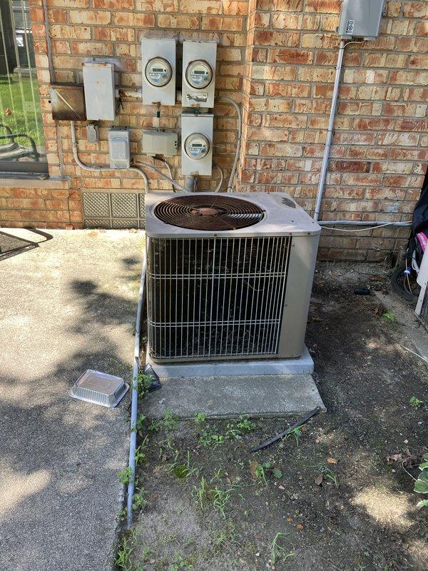 Responded to service call for inadequate cooling from 20+ year-old air conditioning system located in backyard patio area. Performed comprehensive evaluation of outdoor condenser unit positioned on concrete pad against building exterior. Assessed aging equipment condition, documented existing installation including electrical connections, meter configuration, and utility infrastructure. Based on system age and performance issues, provided detailed estimate for complete HVAC system replacement to restore proper cooling capacity and improve energy efficiency.