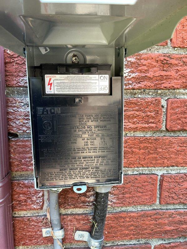 Completed comprehensive Gold AC inspection on 6-year-old residential air conditioning system with basement-located air handler. Performed visual inspection of outdoor condensing unit, verified electrical disconnect operation and proper labeling, examined refrigerant lines noting active frost accumulation on suction line indicating proper system operation and refrigerant flow, inspected service valves and brass fittings for leaks or damage, and documented all major components. System operating within normal parameters with appropriate superheat and subcooling characteristics as evidenced by line temperatures.