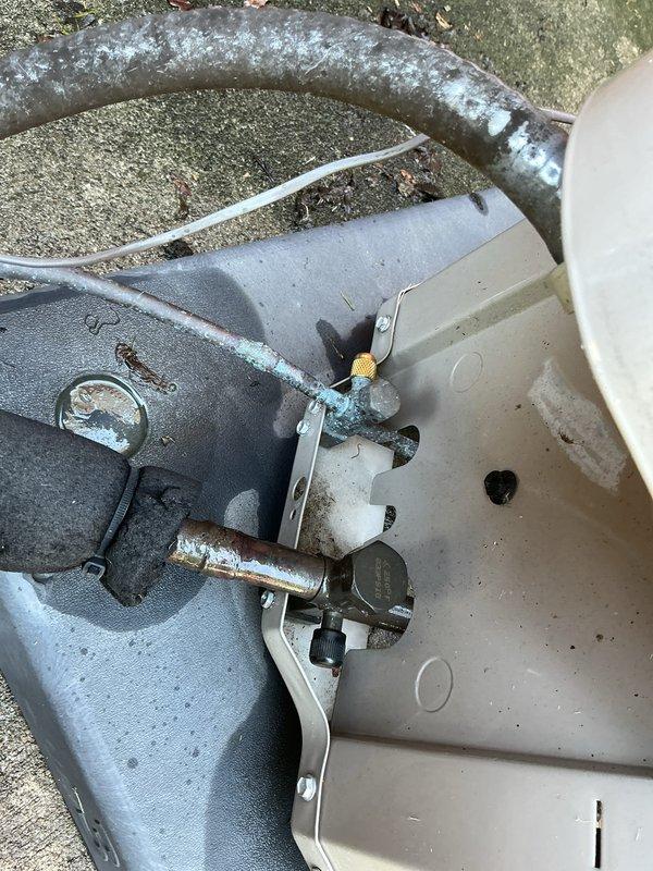 Completed comprehensive Gold AC inspection on 6-year-old residential air conditioning system with basement-located air handler. Performed visual inspection of outdoor condensing unit, verified electrical disconnect operation and proper labeling, examined refrigerant lines noting active frost accumulation on suction line indicating proper system operation and refrigerant flow, inspected service valves and brass fittings for leaks or damage, and documented all major components. System operating within normal parameters with appropriate superheat and subcooling characteristics as evidenced by line temperatures.