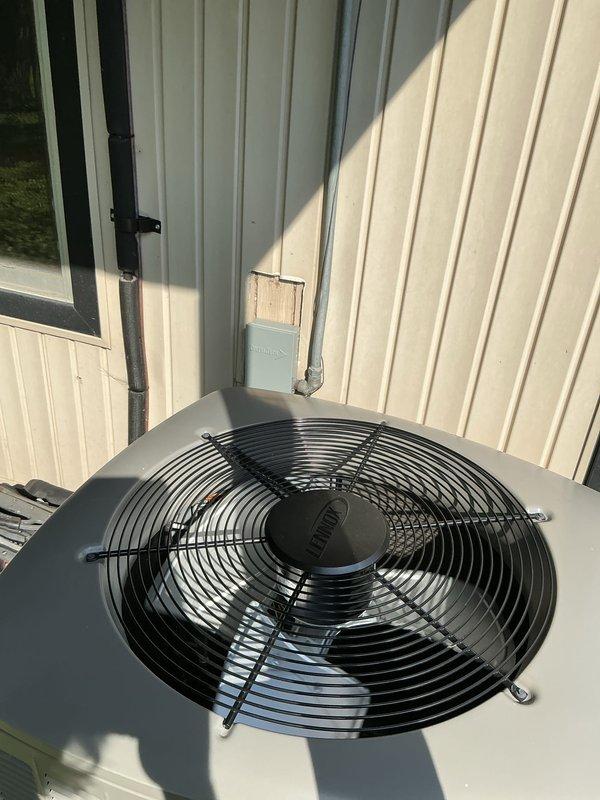 Completed comprehensive Gold AC inspection on single residential air conditioning system less than one year old. Performed thorough examination of outdoor condenser unit, verifying proper operation of fan assembly, protective grille integrity, and overall equipment condition. Inspected electrical connections, conduit mounting, and unit placement on concrete pad with gravel base. Evaluated basement-located air handler/coil system. All components found operating within normal parameters with no visible signs of damage, deterioration, or performance issues. System confirmed fully functional and properly maintained.