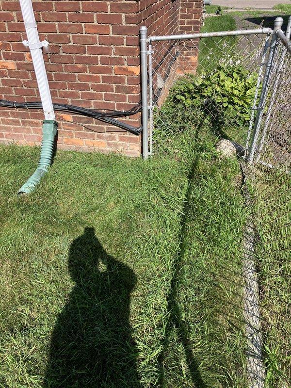 Conducted on-site assessment of existing HVAC equipment for replacement estimate at residential property. Evaluated exterior-mounted utility connections, electrical meter infrastructure, and current system configuration including fuel type determination and equipment accessibility along building exterior. Documented existing conditions with photographic evidence showing weathered meter equipment, drainage systems, and outdoor unit placement area adjacent to brick structure for proper sizing and installation planning of replacement system.
