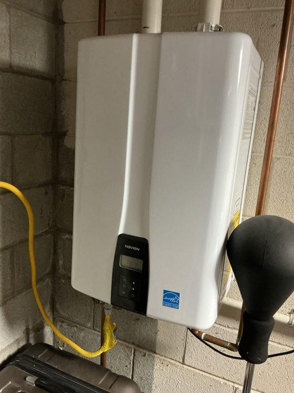 Completed comprehensive Gold AC inspection on 10-year-old residential air conditioning system with air handler located in basement. Performed multi-point inspection including refrigerant level check, electrical component testing, condensate drain evaluation, and airflow assessment. Inspected furnace/air handler unit, associated PVC condensate piping with safety valves, and condensate pump operation. Verified system operational status, installed complimentary air filter, and documented equipment condition with photos. All components found functioning within normal parameters with no immediate repairs required.