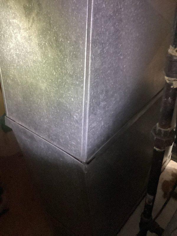 Conducted comprehensive full system estimate for residential HVAC replacement. Assessed existing furnace cabinet with galvanized metal exterior showing well-maintained condition, documented refrigerant line configuration and condensate piping arrangement. Evaluated water heater installation including copper supply lines, brass shut-off valves, and flexible connectors to provide complete system replacement recommendations and captured detailed photographic documentation for estimate preparation.