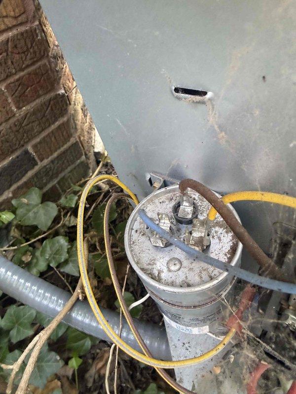 Responded to service call for 12-year-old AC system with non-operational condenser fan motor and unlevel outdoor unit. Upon arrival, found condenser unit heavily soiled with debris accumulation on coil fins and encroaching vegetation around base. Diagnosed failed condenser fan motor preventing proper heat rejection. Cleaned condenser coils, removed debris buildup, and cleared vegetation from unit perimeter. Replaced defective condenser fan motor and capacitor. Leveled outdoor condenser unit on pad to manufacturer specifications to ensure proper drainage and operation. Verified system cooling capacity restored and all components operating within normal parameters. System returned to full operational status.