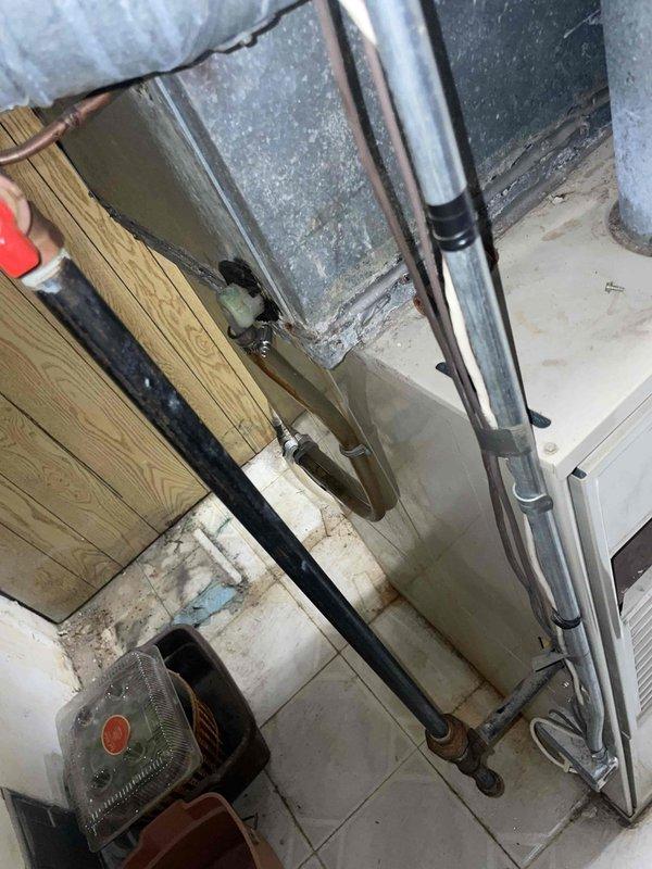 Completed comprehensive estimate for full HVAC system replacement on aging furnace and air conditioning equipment over 15 years old. Assessed existing basement-installed heating system with exposed ductwork and plenum assembly showing dust accumulation and age-related wear. Evaluated outdoor air conditioning unit with copper refrigerant lines displaying oxidation patina and flexible conduit connections at exterior wall penetration. Documented current system configuration including mechanical room layout, existing duct connections, refrigerant line routing, and utility space conditions. Provided detailed replacement recommendations for both heating and cooling components to improve efficiency, reliability, and performance compared to current aged equipment that remains operational but nearing end of service life.