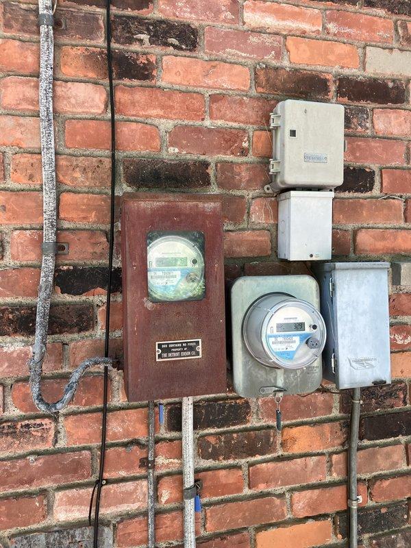 Responded to service call for air conditioning system not providing adequate cooling. Performed comprehensive evaluation of existing outdoor condensing unit located on right side of property, which showed significant age-related wear, discoloration, and dirt accumulation on cabinet surfaces. Documented current system condition through photographic assessment, noting weathered tan metal casing with horizontal louver ventilation grilles, aged concrete pad foundation, and associated electrical components including conduit and junction boxes mounted to brick exterior wall. Provided detailed replacement estimate options for complete system upgrade to address inadequate cooling performance and aging equipment concerns.