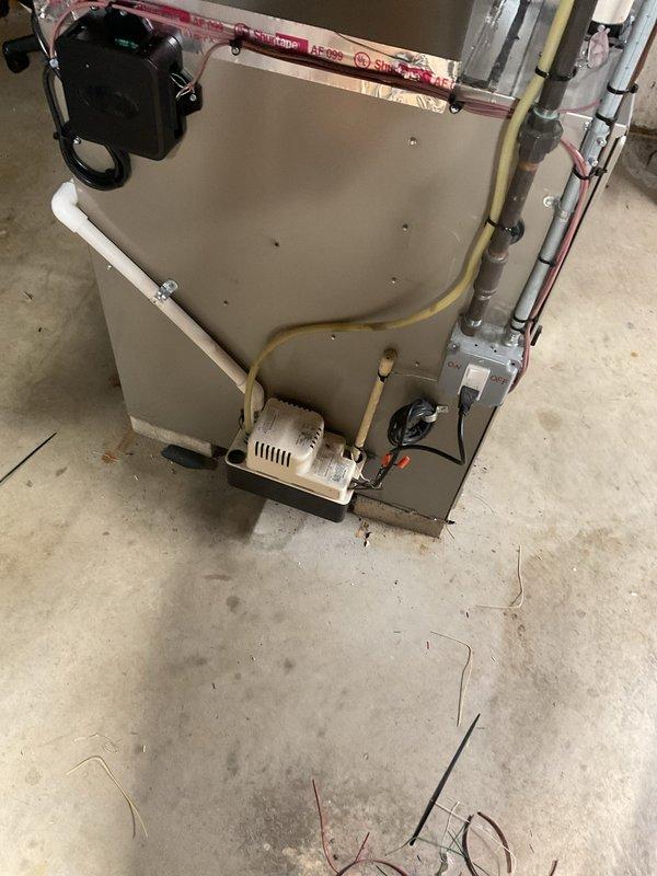 Completed installation of 2.5-ton air conditioning system with matching evaporator coil in rear yard location. Installed new condensate pump and drainage system, reconnected all electrical and refrigerant lines to existing furnace, and verified proper system operation. Mechanical, electrical, and air conditioning permits were obtained prior to installation, and system qualifies for applicable utility rebates.