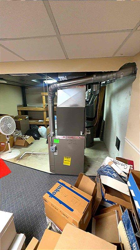 Completed installation of 2.5-ton air conditioning system with matching evaporator coil in residential basement location with rear discharge configuration. Requested mechanical and electrical permits, reconnected refrigerant lines, and performed system startup with temperature measurements to verify proper operation.