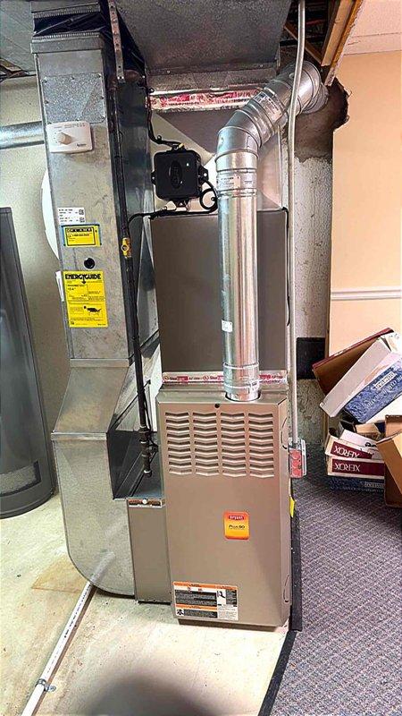 Completed installation of 2.5-ton air conditioning system with matching evaporator coil in residential basement location with rear discharge configuration. Requested mechanical and electrical permits, reconnected refrigerant lines, and performed system startup with temperature measurements to verify proper operation.