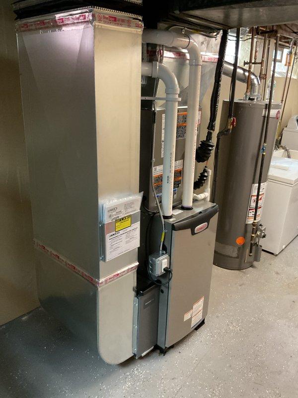 Completed full HVAC system installation in residential basement, including new furnace, air conditioning unit, and condensate pump. Installed copper refrigerant lines with insulation, configured PVC condensate drain lines in Y-configuration, and connected all electrical and plumbing connections per manufacturer specifications. Submitted permit request and documented system for utility rebate programs with AHRI reference number 215584890.