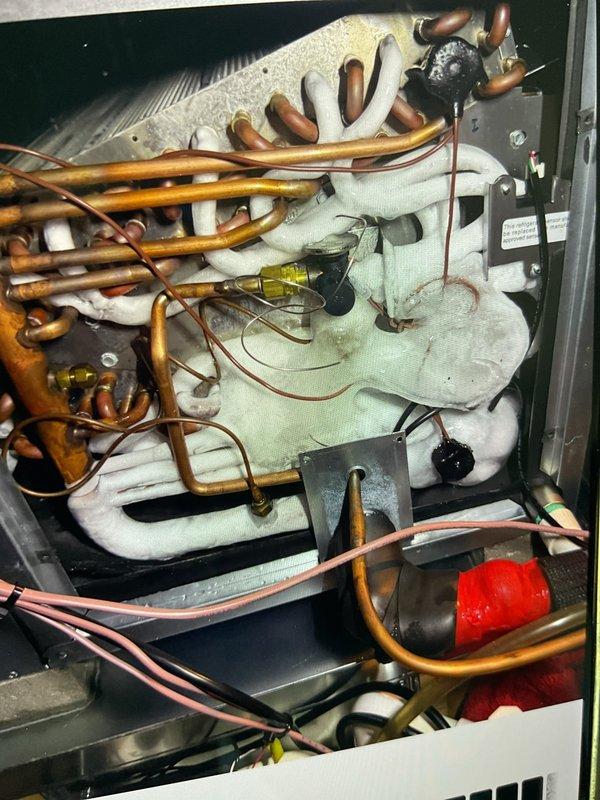 Responded to no-cooling complaint on recently installed AC unit located in basement. Upon inspection, investigated suspected refrigerant leak in copper line system. Performed thorough examination of refrigerant lines, connections, and internal components to identify source of system failure and determine necessary repairs.