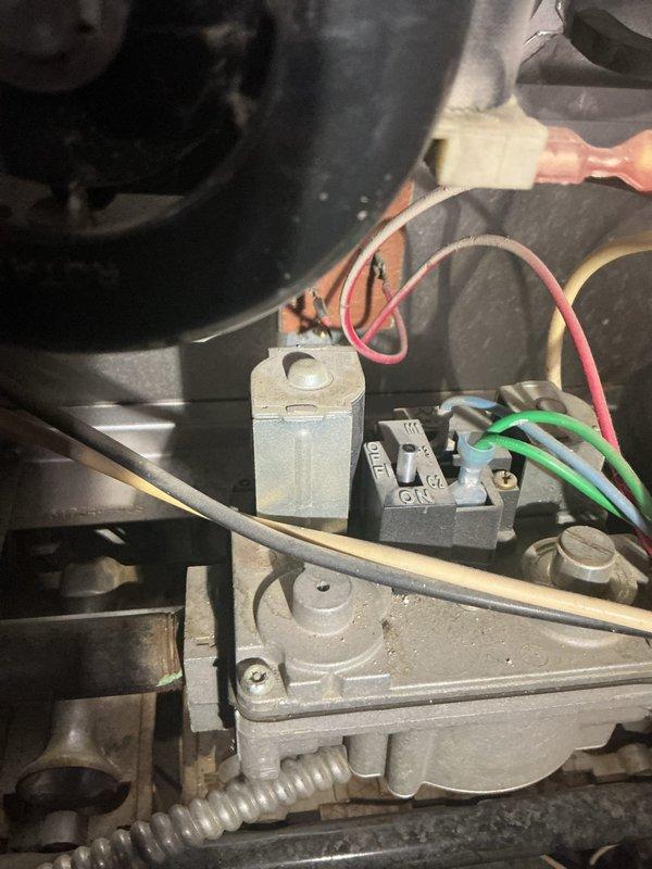 Responded to service call for AC system with reduced cooling capacity and refrigerant line icing at condenser. Upon inspection of the 20-year-old split system with outdoor condenser unit and basement air handler, diagnosed restricted airflow across evaporator coil as primary cause of freezing condition. Inspected blower motor assembly, electrical connections, and control wiring at indoor unit. Checked refrigerant service valves and verified proper operation of system controls. System exhibited classic symptoms of low airflow leading to evaporator coil temperature drop below freezing point, causing ice formation on suction line extending to outdoor unit. Recommended immediate filter replacement and thorough evaporator coil cleaning to restore proper airflow and prevent compressor damage from liquid refrigerant return.