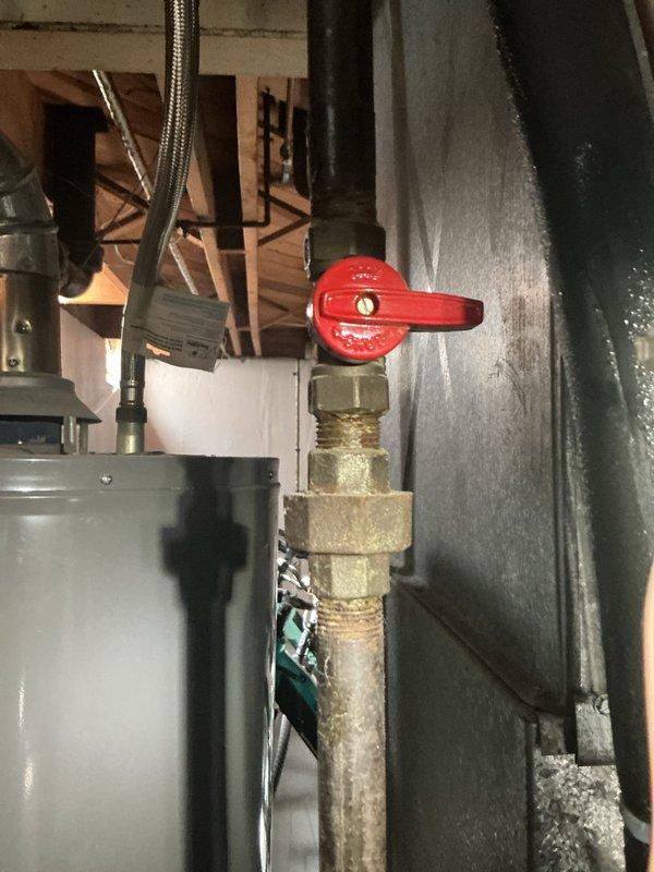 Responded to service call for AC system with reduced cooling capacity and refrigerant line icing at condenser. Upon inspection of the 20-year-old split system with outdoor condenser unit and basement air handler, diagnosed restricted airflow across evaporator coil as primary cause of freezing condition. Inspected blower motor assembly, electrical connections, and control wiring at indoor unit. Checked refrigerant service valves and verified proper operation of system controls. System exhibited classic symptoms of low airflow leading to evaporator coil temperature drop below freezing point, causing ice formation on suction line extending to outdoor unit. Recommended immediate filter replacement and thorough evaporator coil cleaning to restore proper airflow and prevent compressor damage from liquid refrigerant return.