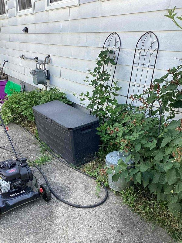 Conducted site evaluation for Kohler generator installation estimate at residential property. Assessed exterior utility connections, existing gas meter location, and available space along foundation for equipment placement. Documented site conditions including proximity to building structure, concrete pad area, and clearance requirements for proper generator installation and maintenance access.