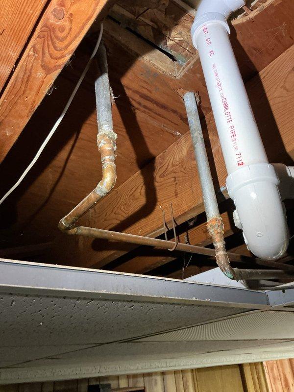 Responded to slow draining main floor shower in 20+ year old home with issue isolated to single fixture. Accessed attic space above affected shower to inspect drainage system and identify obstruction point. Located and cleared blockage in drain line, verified proper flow restoration, and confirmed all connections secure. Shower now draining at normal rate with no additional fixtures affected.