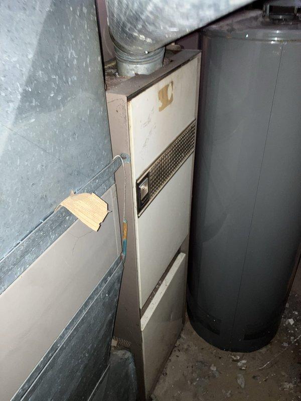 Responded to no-cooling call for residential property with 23-year-old Carrier air conditioning system that had completely failed. Upon inspection, documented existing equipment including outdoor condensing unit with significant vegetation overgrowth and aging indoor furnace with visible wear. Due to advanced age of system and complete failure, provided comprehensive full system replacement estimate covering both outdoor condensing unit and indoor air handler components, explaining benefits of modern high-efficiency equipment versus repair costs on dated system.