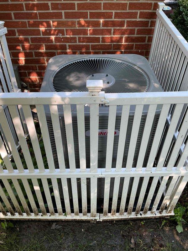 Completed comprehensive Gold AC Inspection on 2-year-old outdoor condensing unit and aging furnace system. AC unit inspected on exterior deck showed proper operation with clean condenser coils, adequate airflow through fan assembly, and secure mounting. Furnace located in basement exhibited active burner operation with visible blue flame pattern across all burners, indicating proper gas-air mixture. Heat exchanger tubes showed age-related surface oxidation consistent with older equipment but remain structurally sound. Verified all electrical connections, control wiring intact on both systems. Minor dust and debris accumulation noted in furnace base area, typical for equipment of this age. Both systems operating within normal parameters with no immediate service needs identified during routine maintenance inspection.