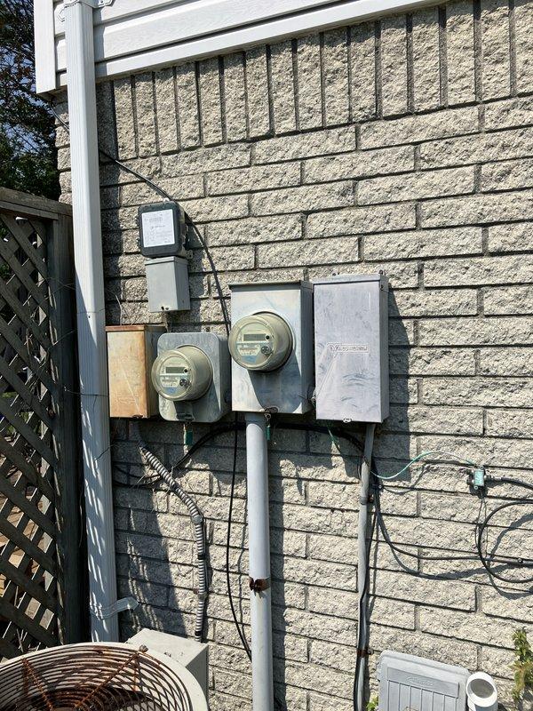 Provided estimate for complete HVAC system replacement including air conditioning unit and natural gas furnace for basement installation. Current 10+ year old equipment is non-operational. Assessment included evaluation of existing electrical service, exterior conduit routing, and PVC condensate drainage configuration to determine replacement specifications and installation requirements.