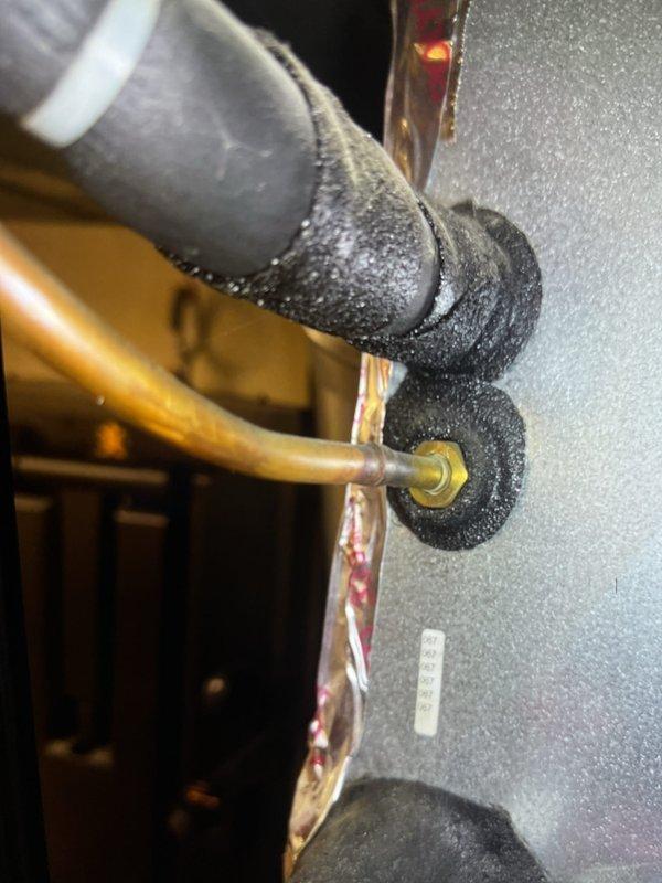 Completed comprehensive Gold AC inspection on 10-year-old basement air handler system. Inspected blower assembly, verified proper operation of fan wheel and motor, checked electrical connections including ground wire integrity, and documented capacitor rating (10µF). Observed significant frost and condensation accumulation on refrigerant line insulation, indicating possible low refrigerant charge, restricted airflow, or metering device issue requiring further diagnostic evaluation and potential service.