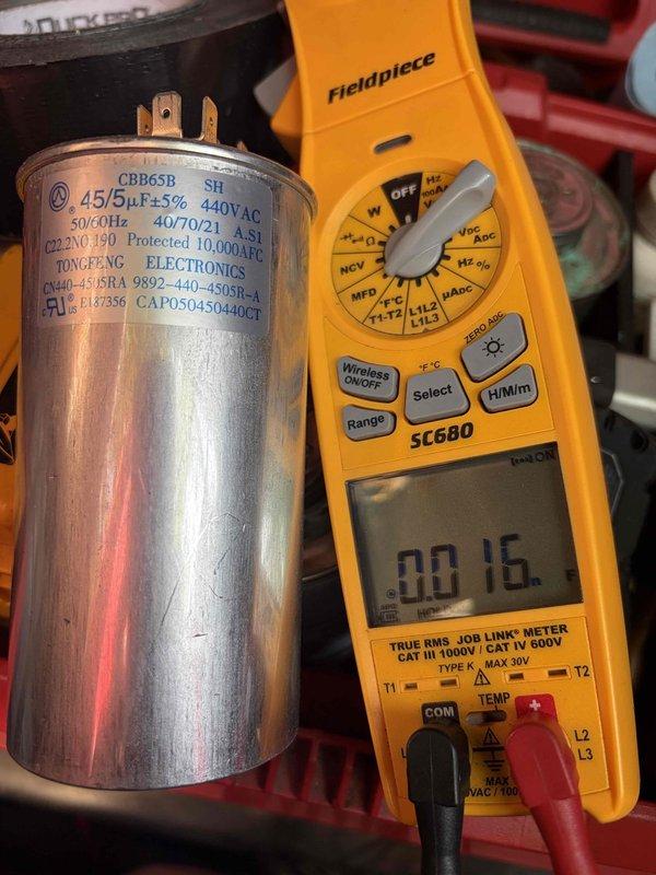 Responded to no-cool call on 5-year-old residential air conditioning system. Upon arrival, diagnosed failed dual-run capacitor (45/5 µF) using Fieldpiece SC680 meter, which prevented compressor and condenser fan motor operation. Replaced defective capacitor and restored system to normal operation. Additionally observed severely contaminated evaporator coil with heavy accumulation of dust, dirt, and debris restricting airflow, which was documented and reported for future maintenance consideration.