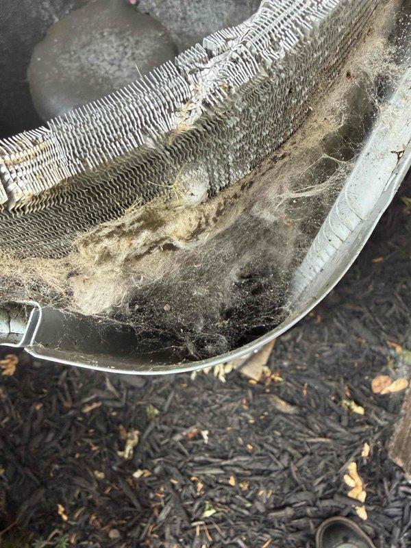 Responded to no-cool call on 5-year-old residential air conditioning system. Upon arrival, diagnosed failed dual-run capacitor (45/5 µF) using Fieldpiece SC680 meter, which prevented compressor and condenser fan motor operation. Replaced defective capacitor and restored system to normal operation. Additionally observed severely contaminated evaporator coil with heavy accumulation of dust, dirt, and debris restricting airflow, which was documented and reported for future maintenance consideration.