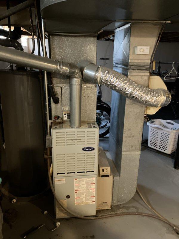 Completed comprehensive HVAC system evaluation on 20-year-old residential air conditioning system experiencing reduced cooling capacity and refrigerant line icing at the condenser. Inspection revealed cracked heat exchanger in basement furnace unit and low refrigerant charge in the AC system. Provided full system estimate for replacement of both indoor and outdoor equipment due to age of components and extent of required repairs exceeding cost-effectiveness of individual component replacement.