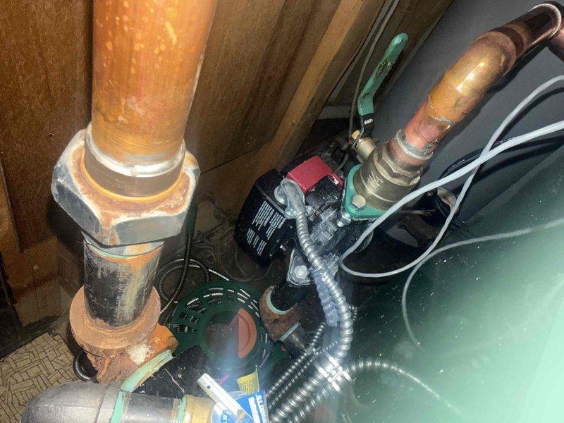 Returned to complete boiler piping repair to address active system leak. Tightened 1-1/4" union connection at circulator pump using appropriately sized wrench and performed soldering work at top of circulator pump to seal leaking joints. System tested and verified leak-free operation upon completion.