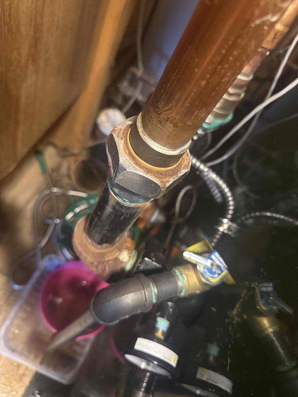 Returned to complete boiler piping repair to address active system leak. Tightened 1-1/4" union connection at circulator pump using appropriately sized wrench and performed soldering work at top of circulator pump to seal leaking joints. System tested and verified leak-free operation upon completion.