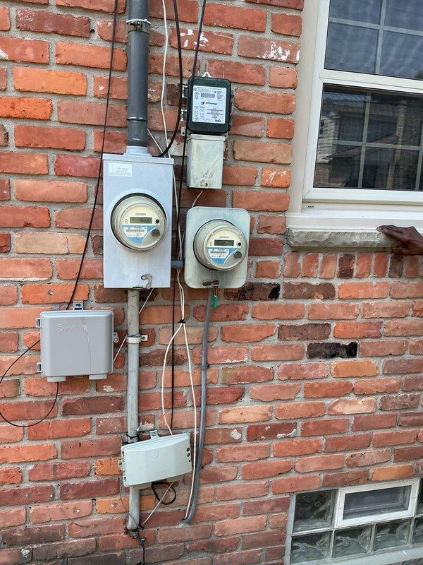 Completed electrical estimate for new whole home generator installation at brick residential structure. Evaluated existing electrical service with dual digital smart meters and main distribution panel to determine generator integration requirements. Assessed current electrical infrastructure including metering system, service entrance conduit routing, and main breaker panel capacity to develop comprehensive installation plan for automatic transfer switch and generator connection to existing electrical system.