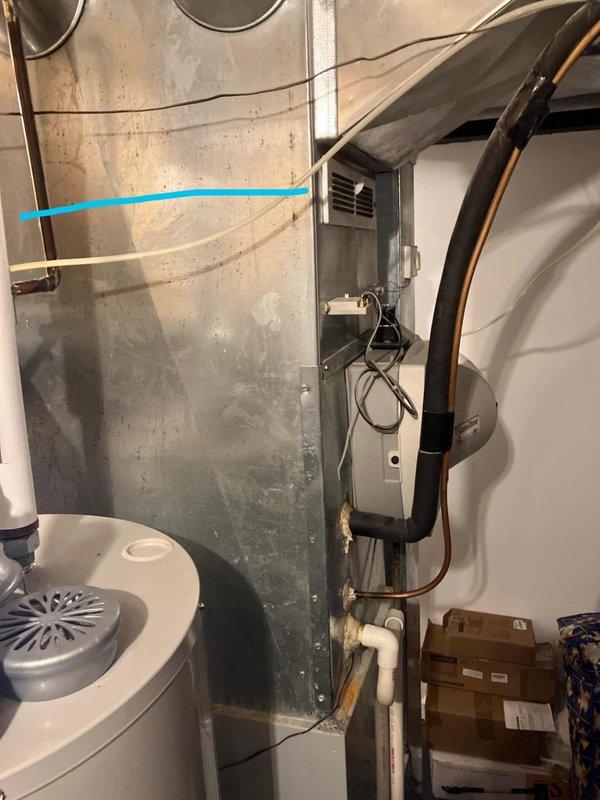 Conducted comprehensive replacement estimate for 26-year-old residential air conditioning system. Evaluated existing outdoor condensing unit located on patio and assessed indoor air handler equipment in basement mechanical room. Documented current system configuration including refrigerant line sets, ductwork connections, and electrical components. Photographed all major equipment including furnace, air handler, copper refrigerant lines, and supply ductwork to provide accurate sizing and replacement specifications for new cooling system installation.