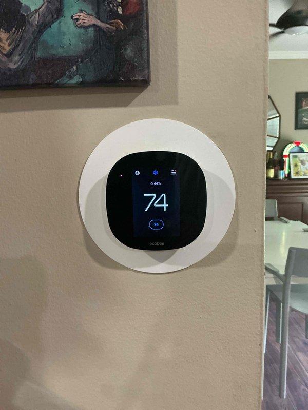 Performed comprehensive AC tune-up on 10+ year old outdoor condensing unit with no reported operational issues. Inspected and verified proper operation of system controlled by ecobee smart thermostat currently set to 74°F. Completed standard preventive maintenance procedures including visual inspection of gas furnace manufactured October 2018, verified all safety labels and warnings intact, and confirmed system readiness for continued operation.