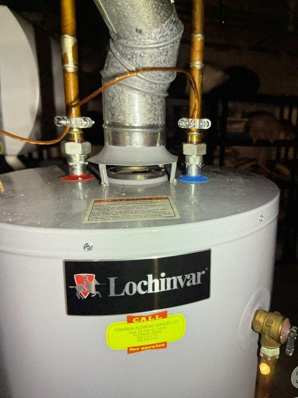 Completed comprehensive Gold AC Inspection on 7-year-old residential air conditioning system with air handler located in basement. Performed thorough evaluation of all system components including condenser unit, evaporator coil, refrigerant levels, electrical connections, and airflow measurements. Inspected and documented existing pleated air filter showing moderate dust accumulation from normal operation. Examined water heater and associated plumbing connections in utility area as part of overall HVAC system assessment. Verified all copper refrigerant lines, brass fittings, and connections for proper installation and absence of leaks. System found to be operating within normal parameters with no immediate service requirements identified at time of inspection.