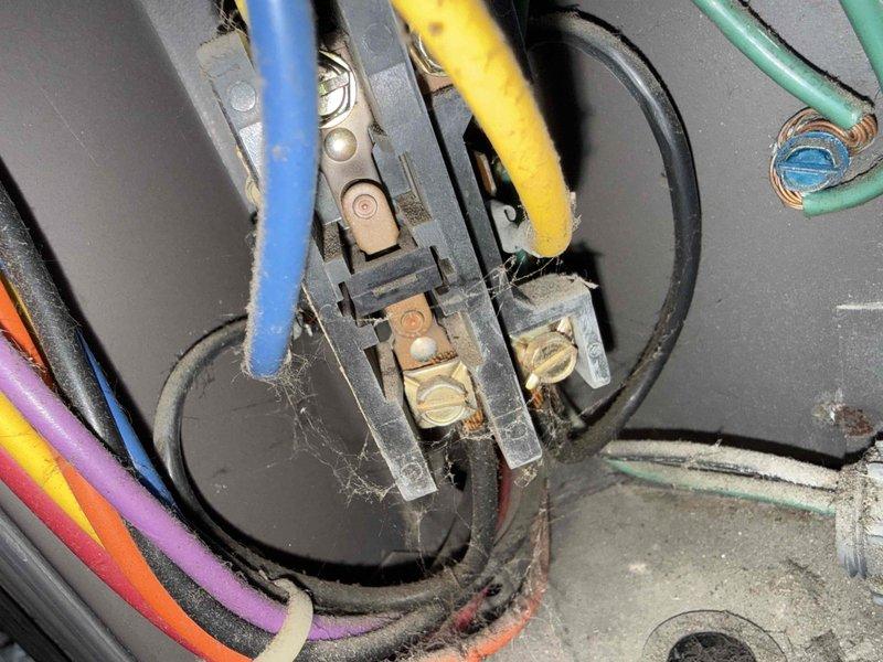Responded to service call for 30-year-old central air conditioning system with inadequate cooling performance. Upon arrival, performed comprehensive system diagnostics including electrical testing at the outdoor unit's terminal block and measured voltage/amperage readings using digital multimeter. Visual inspection revealed accumulated debris and deterioration at electrical connections consistent with the age of the equipment. Testing confirmed system operational deficiencies affecting cooling capacity. Documented findings with photographic evidence of electrical components and diagnostic measurements for service records.