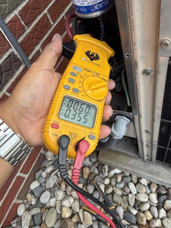 Responded to service call for 30-year-old central air conditioning system with inadequate cooling performance. Upon arrival, performed comprehensive system diagnostics including electrical testing at the outdoor unit's terminal block and measured voltage/amperage readings using digital multimeter. Visual inspection revealed accumulated debris and deterioration at electrical connections consistent with the age of the equipment. Testing confirmed system operational deficiencies affecting cooling capacity. Documented findings with photographic evidence of electrical components and diagnostic measurements for service records.