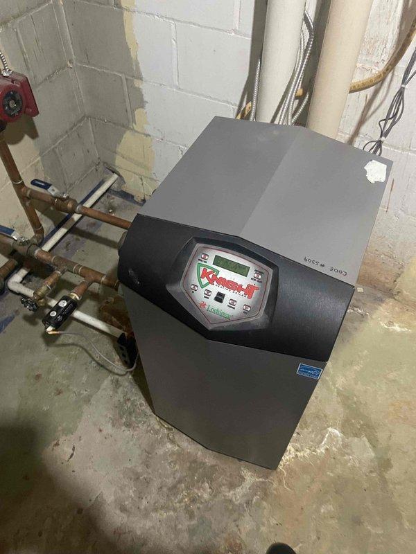 Provided comprehensive estimate for complete Unico high-velocity air conditioning system replacement to service existing 15-year-old equipment currently in operation. Assessed installation requirements for air handler placement in attic space and outdoor condensing unit positioned at left side of residence, with existing boiler system to remain as primary heating source. Documented current system configuration including programmable thermostat and boiler equipment with digital controls, evaluated accessibility for new equipment installation, and reviewed copper piping connections and utility infrastructure to ensure compatibility with proposed high-velocity system specifications.