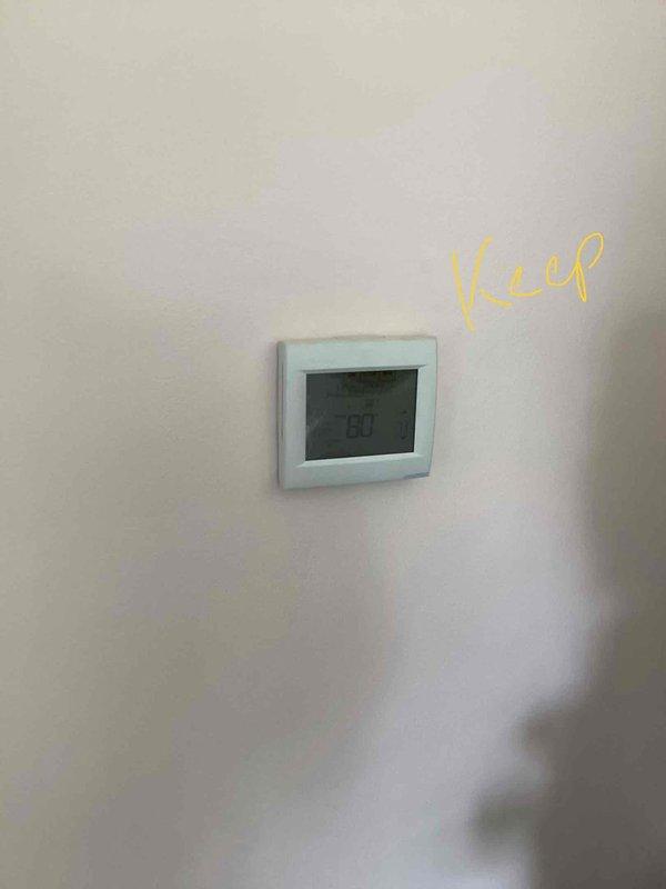 Performed comprehensive evaluation of 20-year-old HVAC system located in basement following reports of furnace failure. Assessed existing air handler unit, ductwork configuration, and associated mechanical components including Honeywell control systems. Documented current equipment condition through photographic records showing existing thermostat set at 80 degrees and overall system layout. Provided detailed replacement estimate for complete HVAC system replacement due to age and equipment failure.