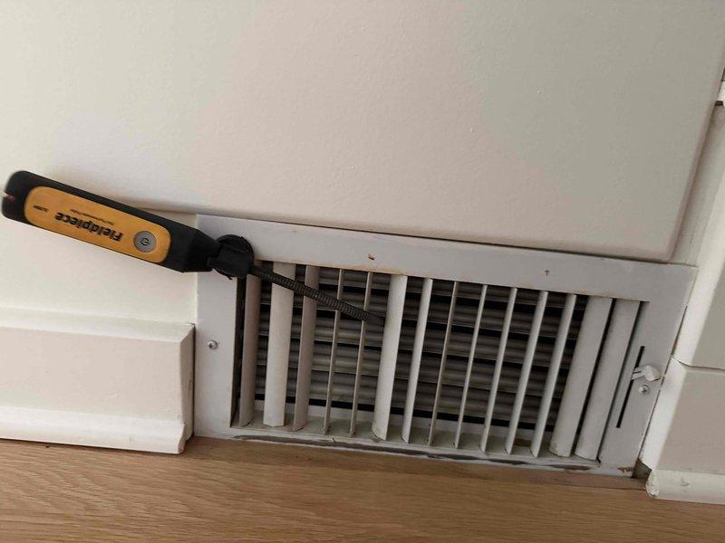 Responded to service call for uneven cooling with upstairs area measuring 15 degrees warmer than downstairs despite newer system maintaining heating and cooling capability. Performed diagnostic evaluation of central air conditioning system and ductwork distribution. Inspected floor-mounted supply registers and vents throughout home, identifying potential airflow restriction issues at multiple locations with visible dirt accumulation and possible damper positioning concerns that could contribute to inadequate second-floor cooling performance.