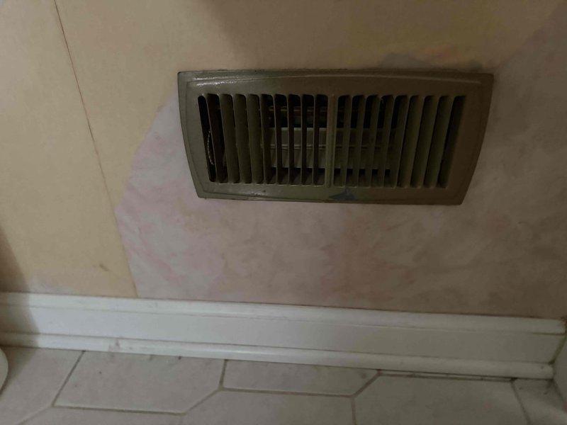 Responded to service call for uneven cooling with upstairs area measuring 15 degrees warmer than downstairs despite newer system maintaining heating and cooling capability. Performed diagnostic evaluation of central air conditioning system and ductwork distribution. Inspected floor-mounted supply registers and vents throughout home, identifying potential airflow restriction issues at multiple locations with visible dirt accumulation and possible damper positioning concerns that could contribute to inadequate second-floor cooling performance.