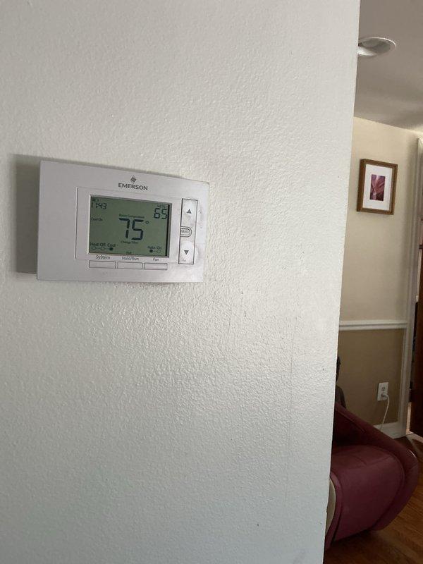 Completed comprehensive Gold AC inspection on 3-year-old residential HVAC system with basement-located air handler. Performed multi-point system evaluation including thermostat functionality verification, temperature differential readings, and visual equipment assessment. Thermostat operating properly with display showing 75°F set point and system responding appropriately. Inspected air handler unit and associated ductwork for proper installation, secure connections, and operational integrity. All components found in good working condition with no immediate service needs identified. Renewed maintenance plan on-site per customer request to continue coverage under Gold service agreement.