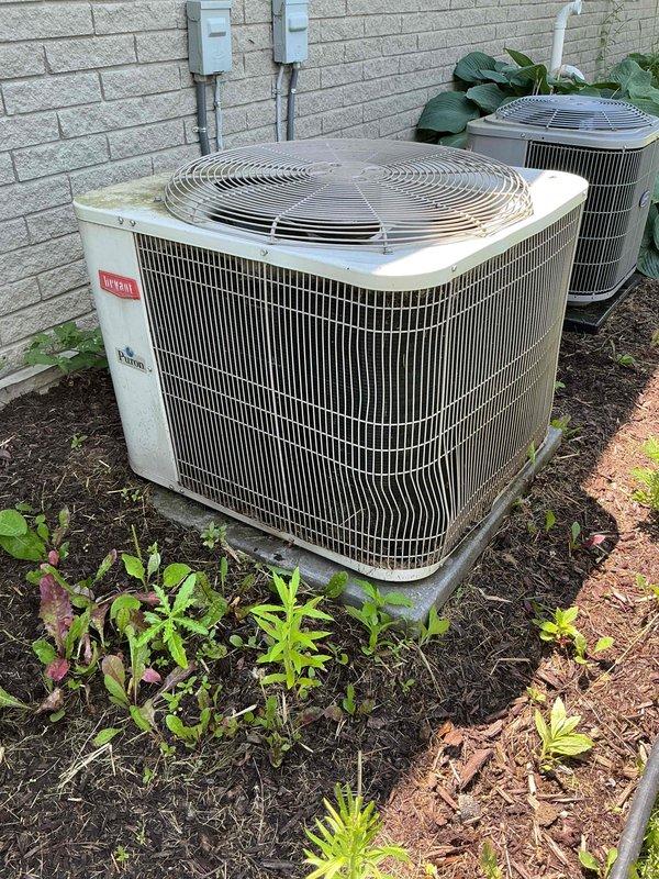 Completed Gold AC Inspection and routine maintenance on two outdoor condenser units, both approximately 7 years old. Performed comprehensive tune-up procedures including visual inspection of both Carrier units positioned against exterior wall, checked electrical connections and conduit, verified proper mounting and clearances, inspected refrigerant lines, and assessed overall system operation. Both units showed normal wear consistent with age; no immediate repairs required at time of service.