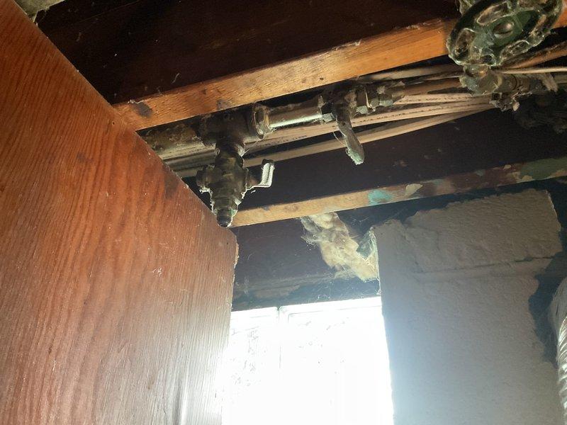 Provided quote for gas line installation to connect dryer in unfinished utility space. Assessed existing gas piping infrastructure, structural layout, and routing requirements through exposed joists and beams. Documented current conditions including exposed metal piping, ductwork placement, and available connection points for proposed gas line extension to dryer location.