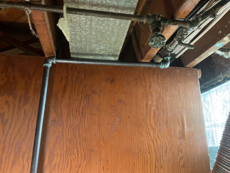 Provided quote for gas line installation to connect dryer in unfinished utility space. Assessed existing gas piping infrastructure, structural layout, and routing requirements through exposed joists and beams. Documented current conditions including exposed metal piping, ductwork placement, and available connection points for proposed gas line extension to dryer location.