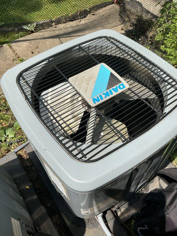 Completed comprehensive Gold AC inspection on multi-unit residential HVAC system with three 8-year-old air conditioning units and basement-located air handler. Performed thorough examination of outdoor Daikin condenser units, verified operational status of all equipment, inspected condenser coils and fan assemblies, checked refrigerant line connections, and assessed overall system performance. All units found to be operating within normal parameters with no immediate service concerns identified.