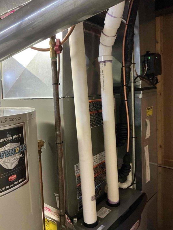 Completed installation of 2.5-ton Lennox air conditioning system with matching evaporator coil in residential property. Outdoor condensing unit positioned on concrete pad in rear yard with proper clearances maintained; indoor air handler and coil installed in basement utility area with new refrigerant lines, condensate drain piping, and electrical connections. System tested and verified operational with all components functioning to manufacturer specifications.